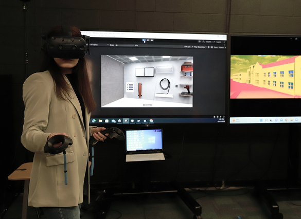 Student using virtual reality equipment in lab setting